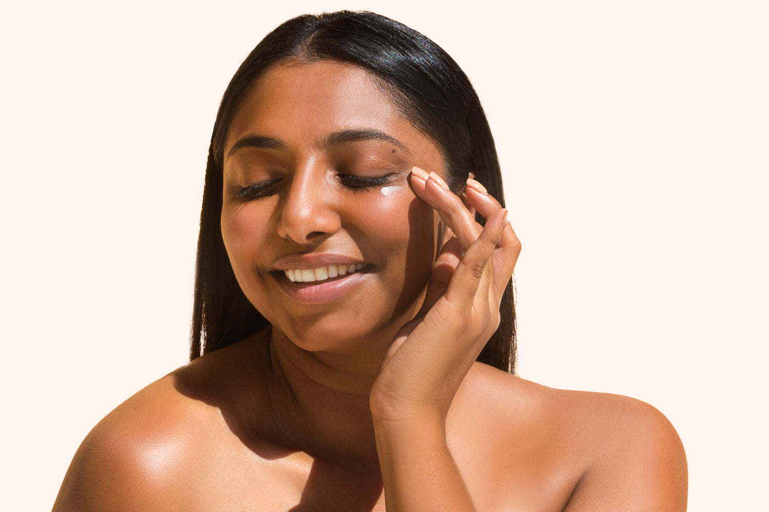 Image of woman applying Plantkos eye cream