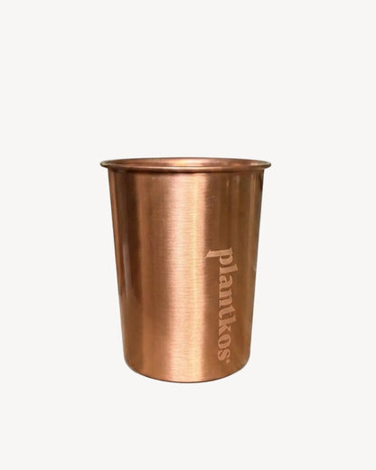 Copper cup with 'plantkos' branding on a white background